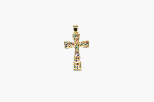 Gold cross pendant with colorful gemstones on a white background