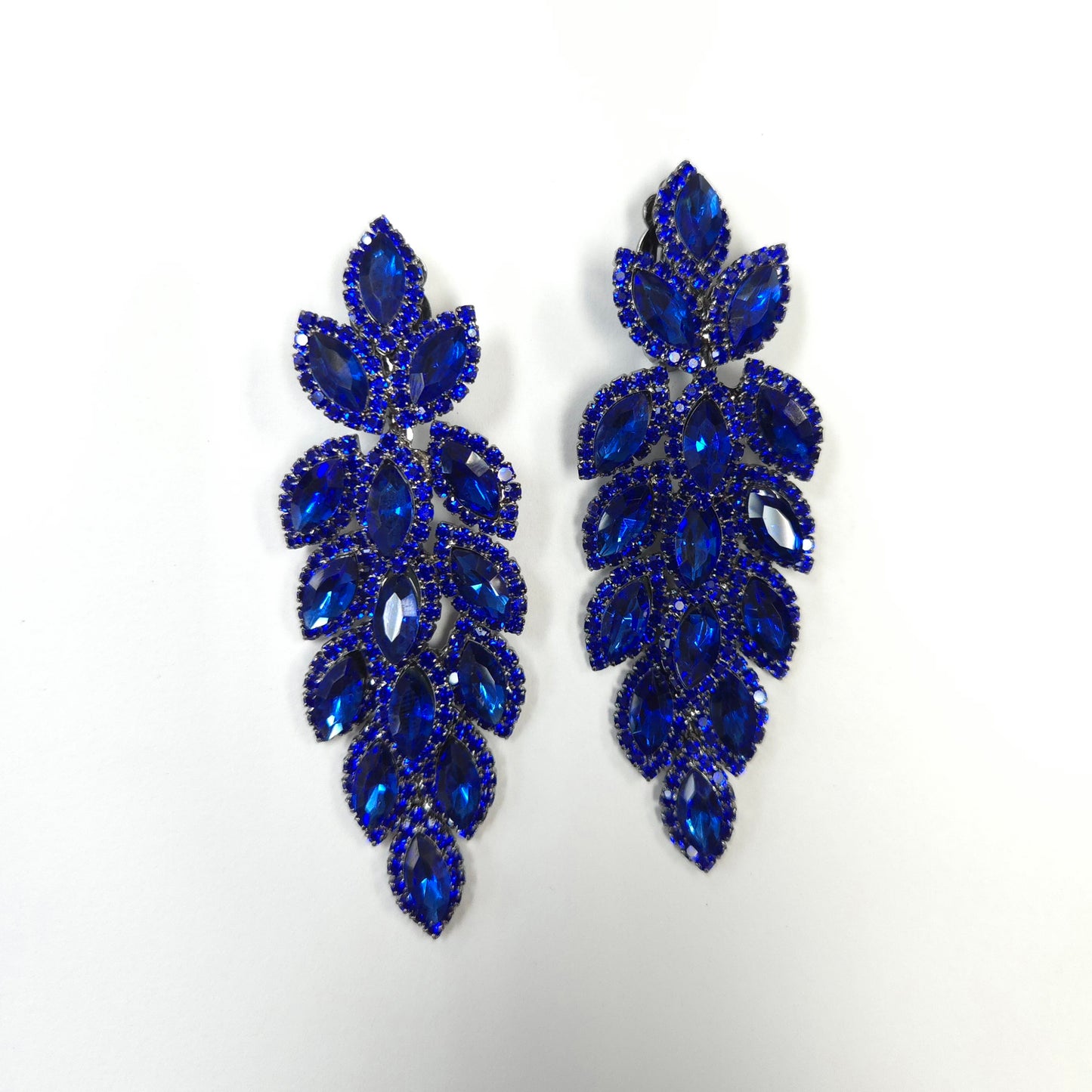 Pair of blue leaf-shaped earrings on a white background