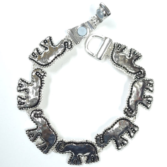Silver-tone elephant link bracelet featuring textured antique-inspired detailing and decorative artisan-style craftsmanship.