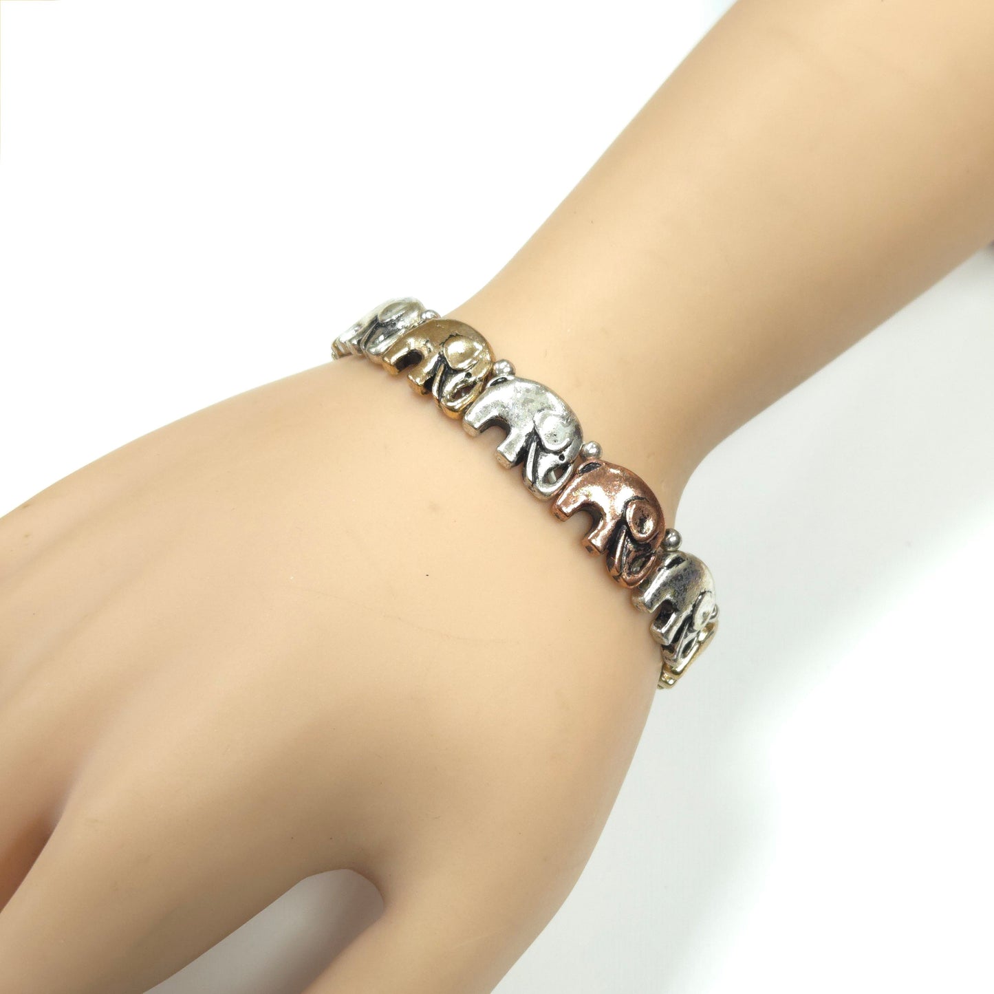 Bracelet with elephant designs on a wrist against a white background
