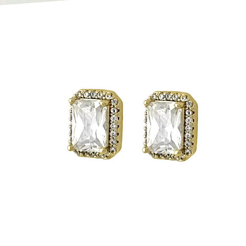 Gold earrings with clear gemstones on a white background