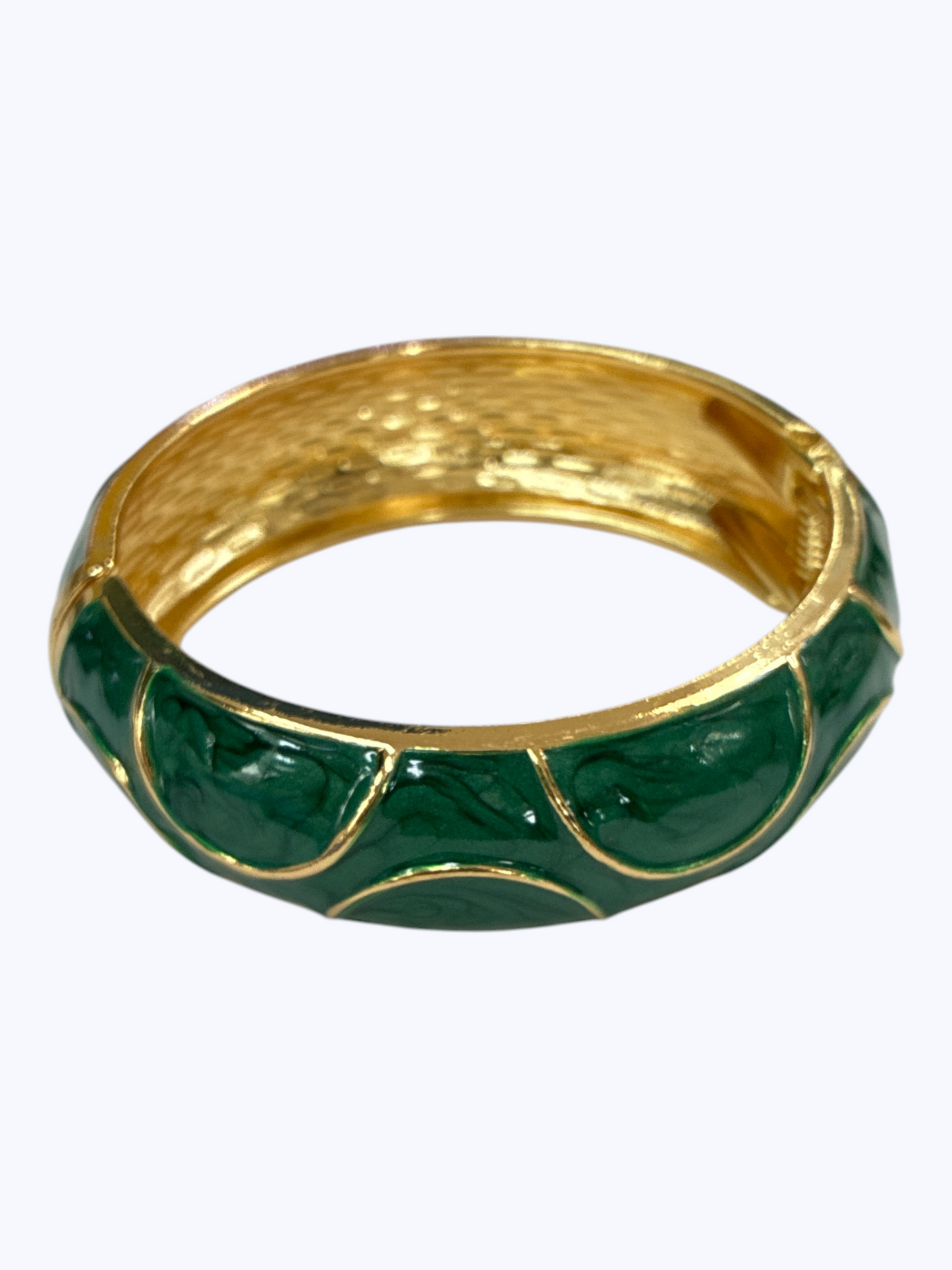 Gold-tone hinged bangle bracelet with glossy emerald green enamel accents and textured metallic finish for a luxe boutique-inspired look.