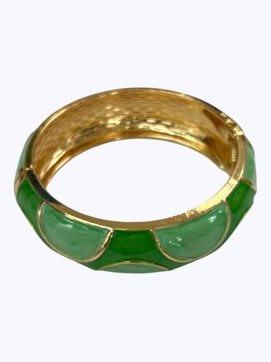 Gold-tone hinged bangle bracelet with glossy green enamel accents and textured metallic finish for an elegant boutique-inspired look.