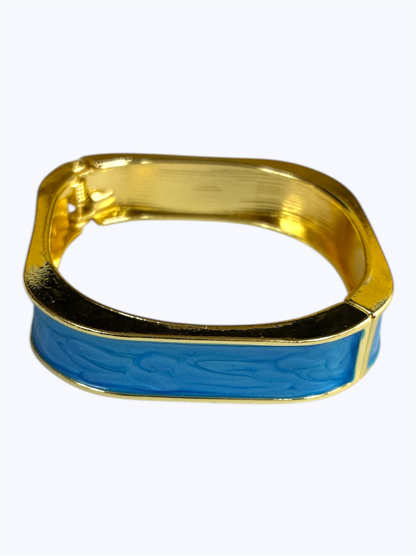 Gold and blue bracelet on a white background
