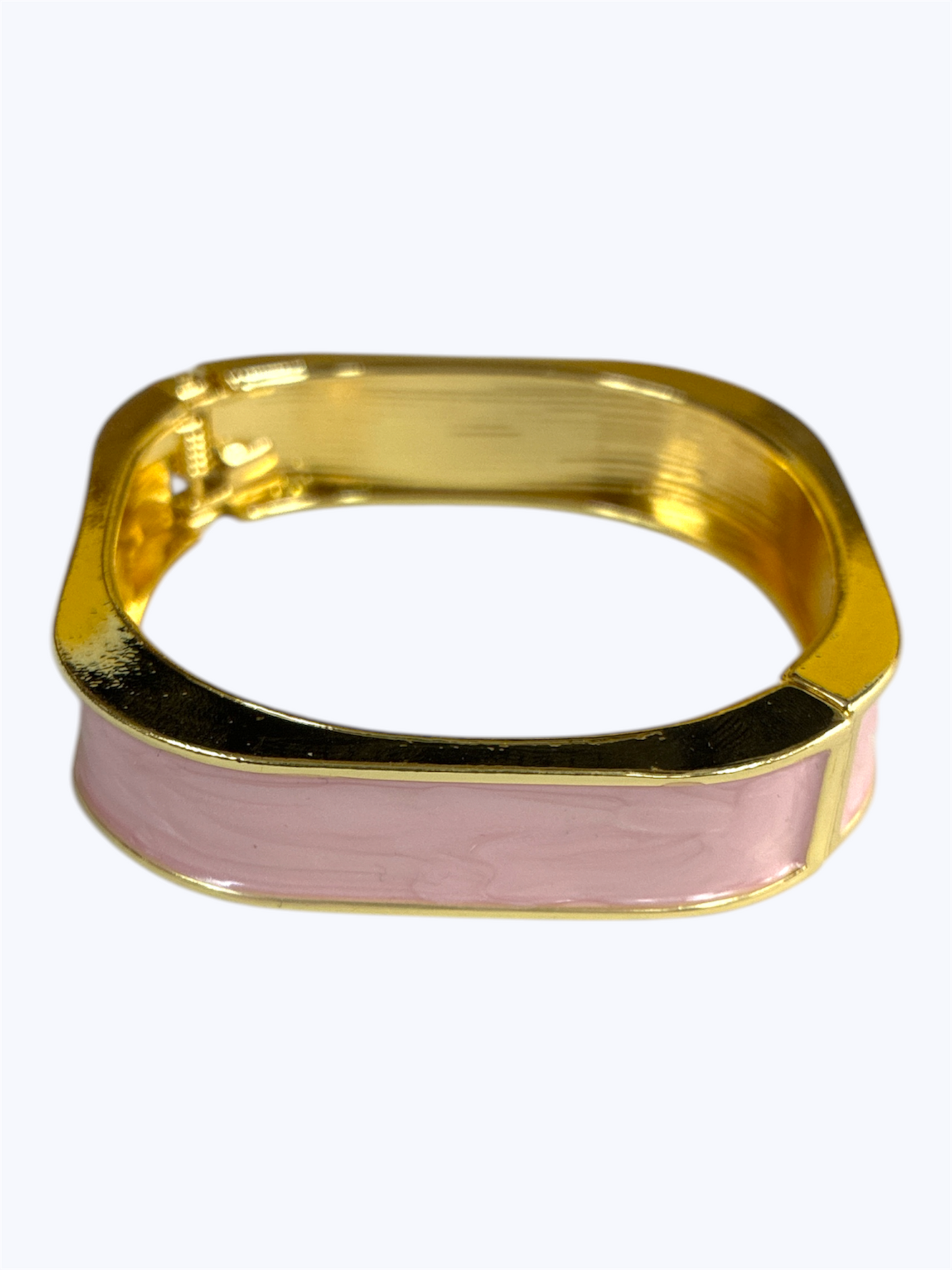 Gold and pink bracelet on a white background