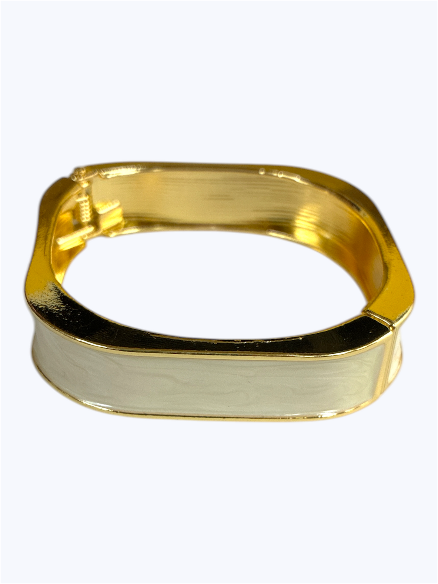 Gold ring with a rectangular design on a white background