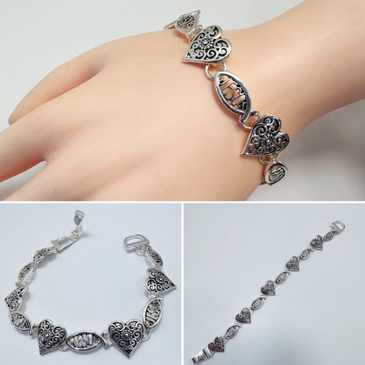 Filigree heart link bracelet with ornate openwork detailing and vintage inspired design