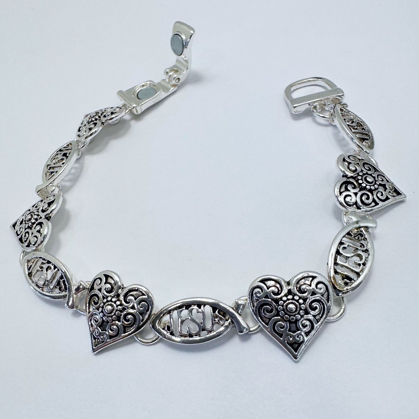 Filigree heart link bracelet with ornate openwork detailing and vintage inspired design