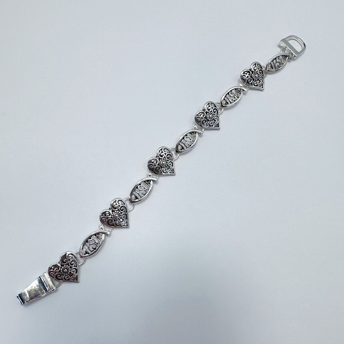 Filigree heart link bracelet with ornate openwork detailing and vintage inspired design