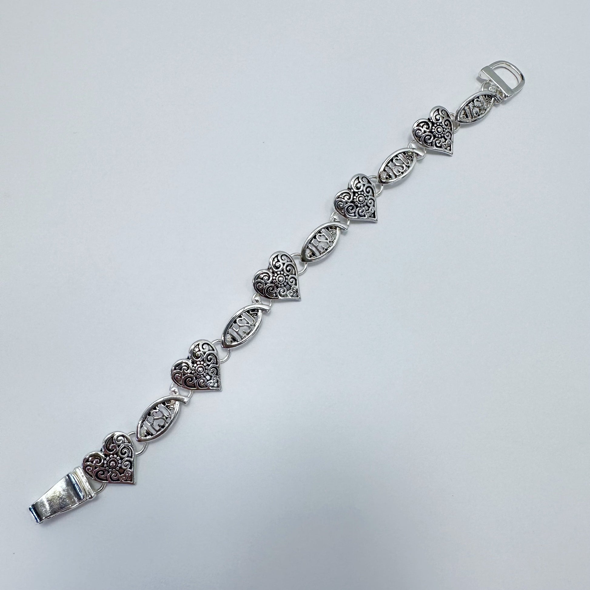 Filigree heart link bracelet with ornate openwork detailing and vintage inspired design