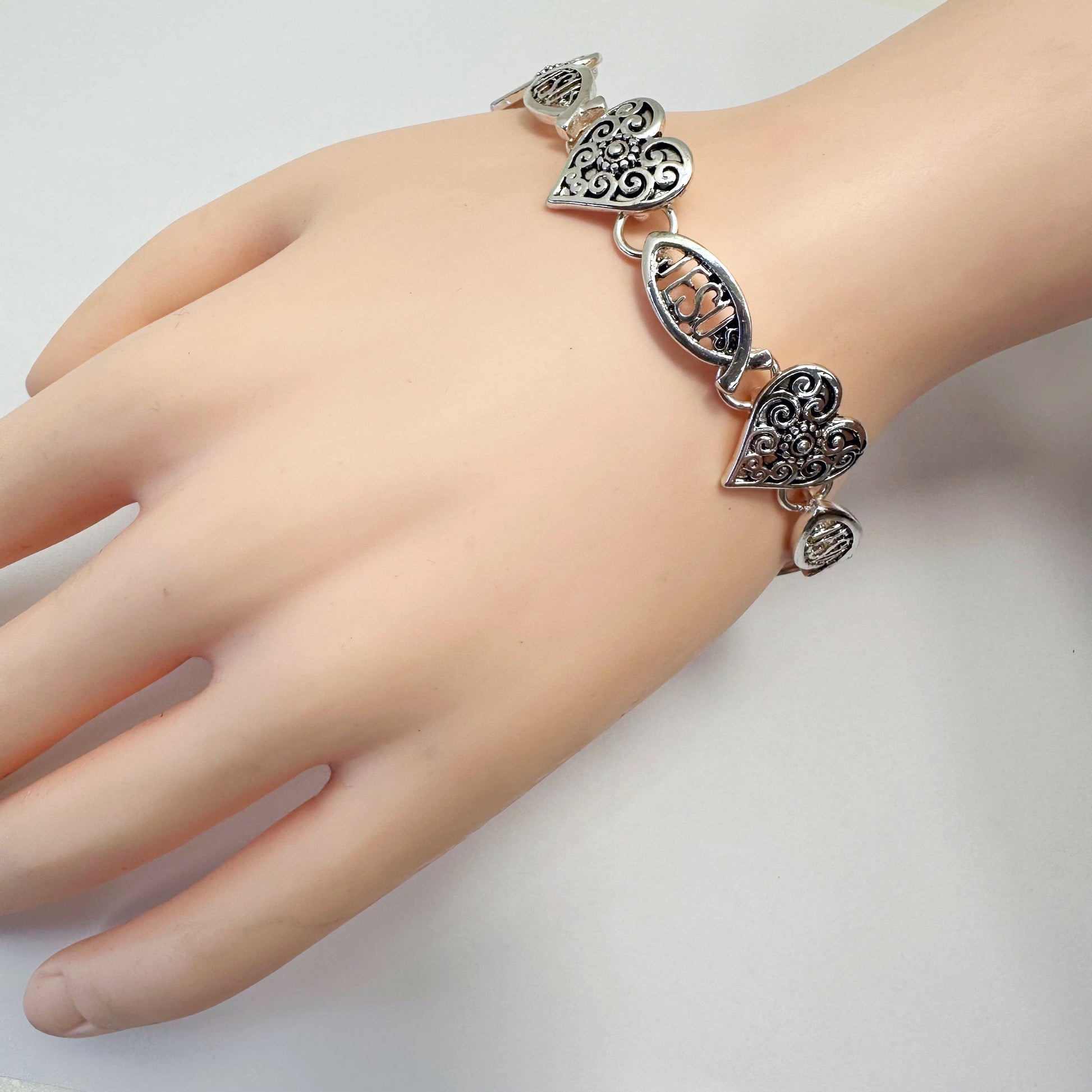Filigree heart link bracelet with ornate openwork detailing and vintage inspired design
