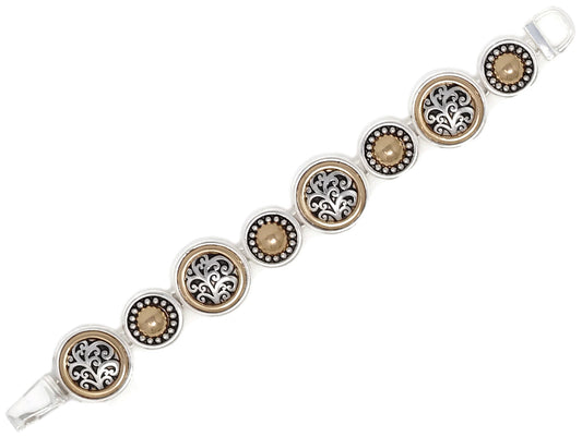 Two-tone link bracelet featuring ornate filigree medallions, textured accents, and vintage-inspired detailing.