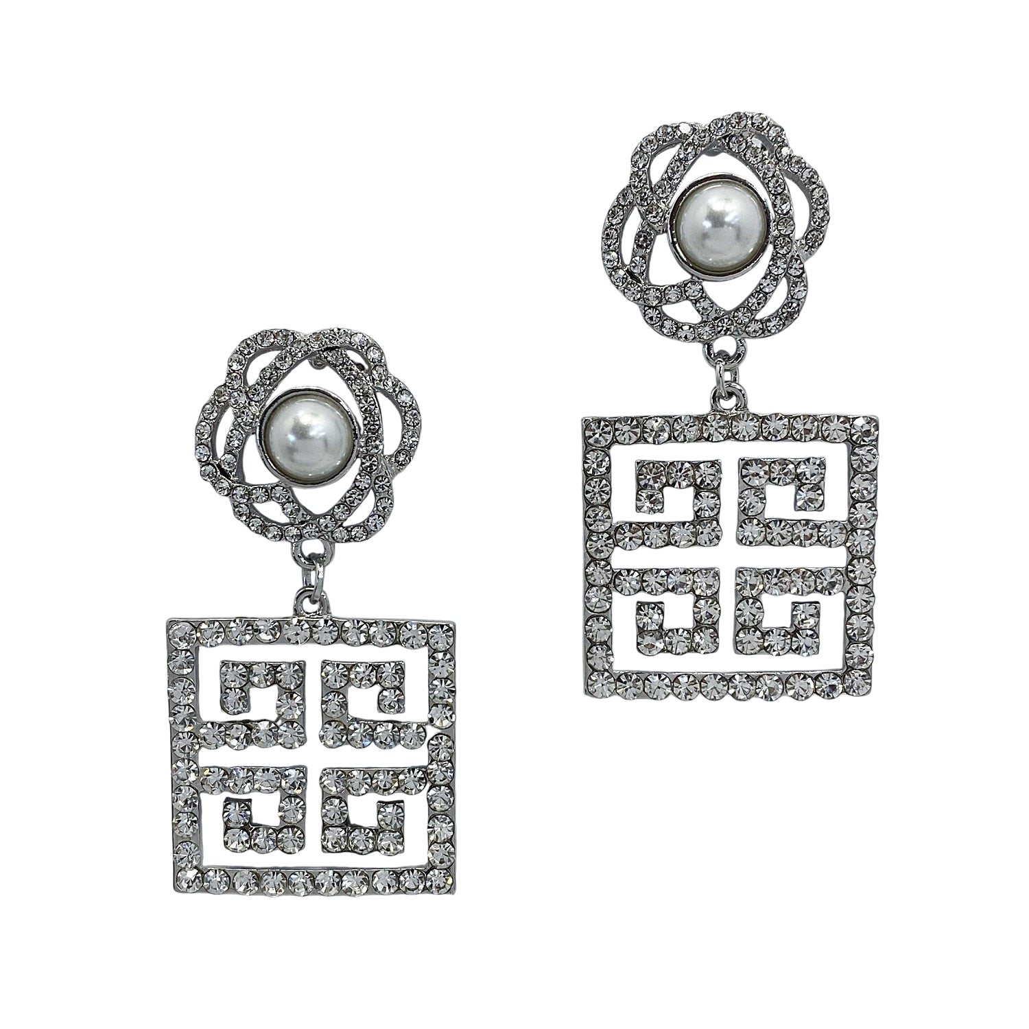 Pair of earrings with geometric designs and pearl-like centers on a white background