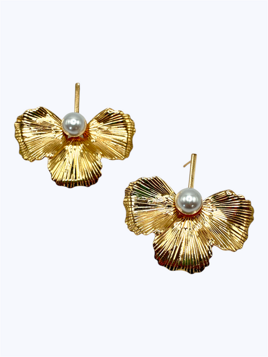 Textured floral stud earrings with sculpted petal design and pearl center accent.