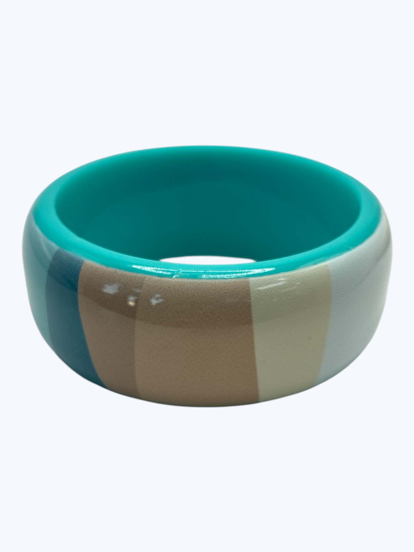 Colorful ceramic bowl with striped design on a white background