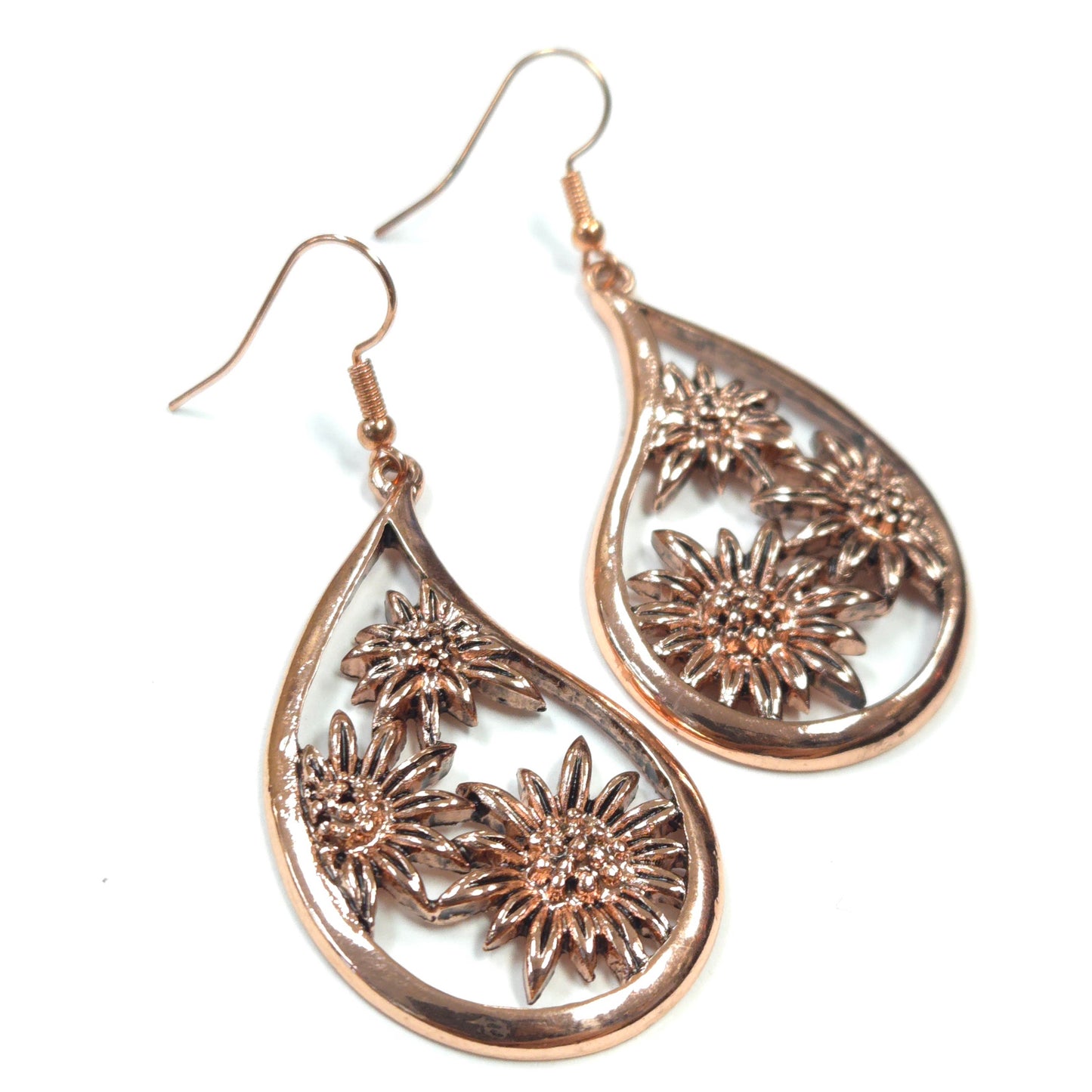 Rose gold teardrop earrings with floral designs on a white background