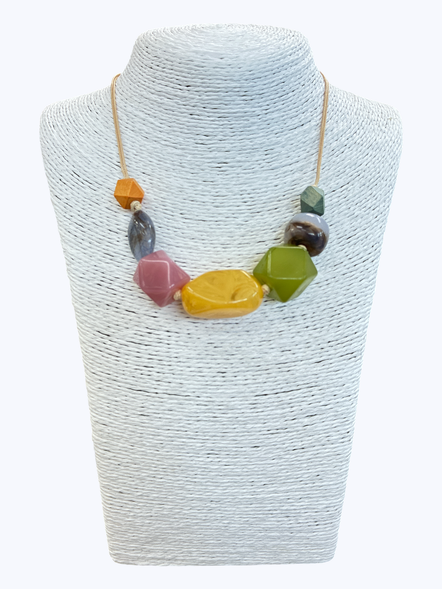 Colorful statement bead necklace with glossy resin accents in yellow, pink, green, and gray tones for a fun modern boutique style.