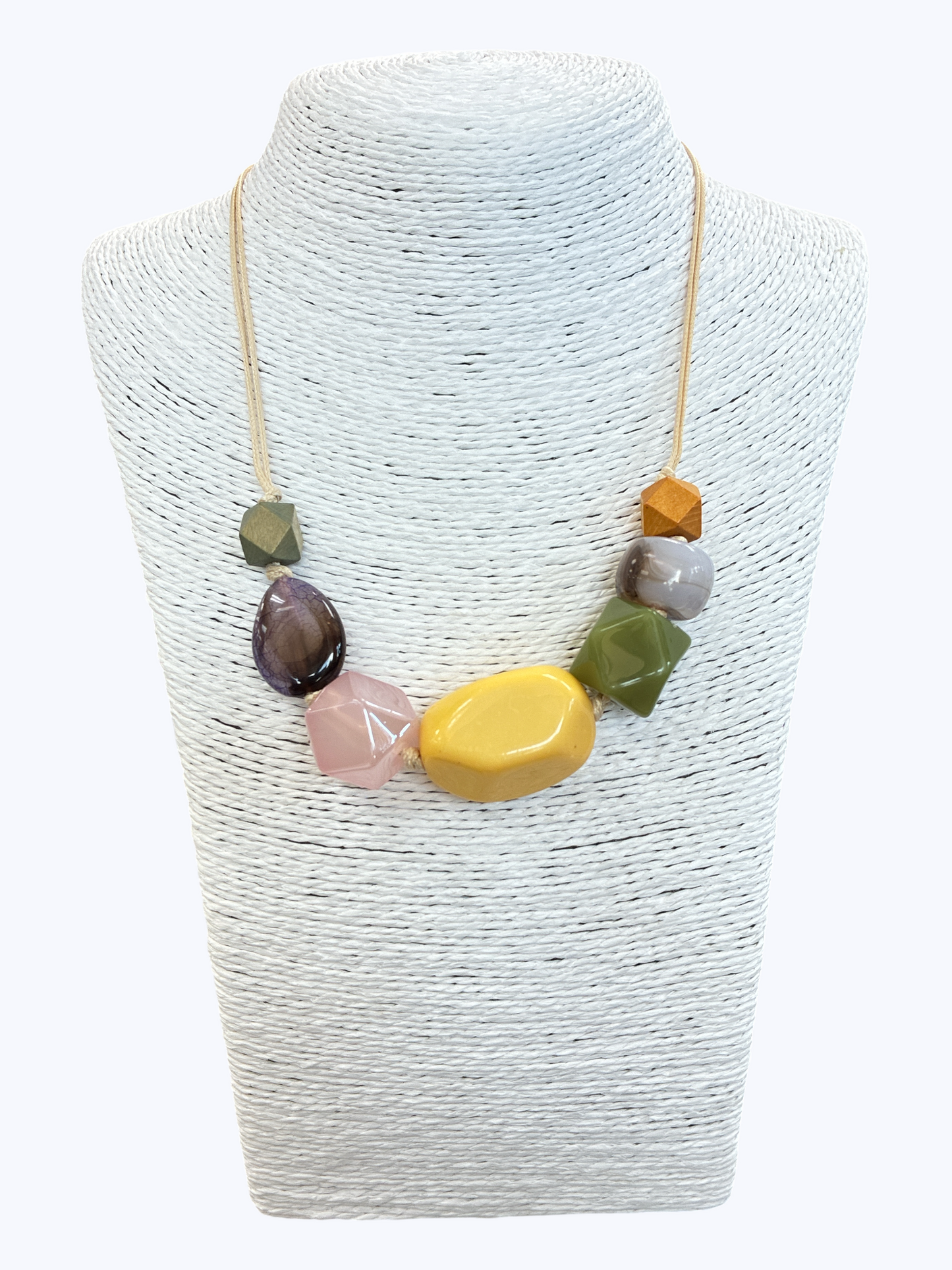 Multicolor statement bead necklace with glossy resin accents in yellow, olive, blush, and gray tones for a bold contemporary boutique style.