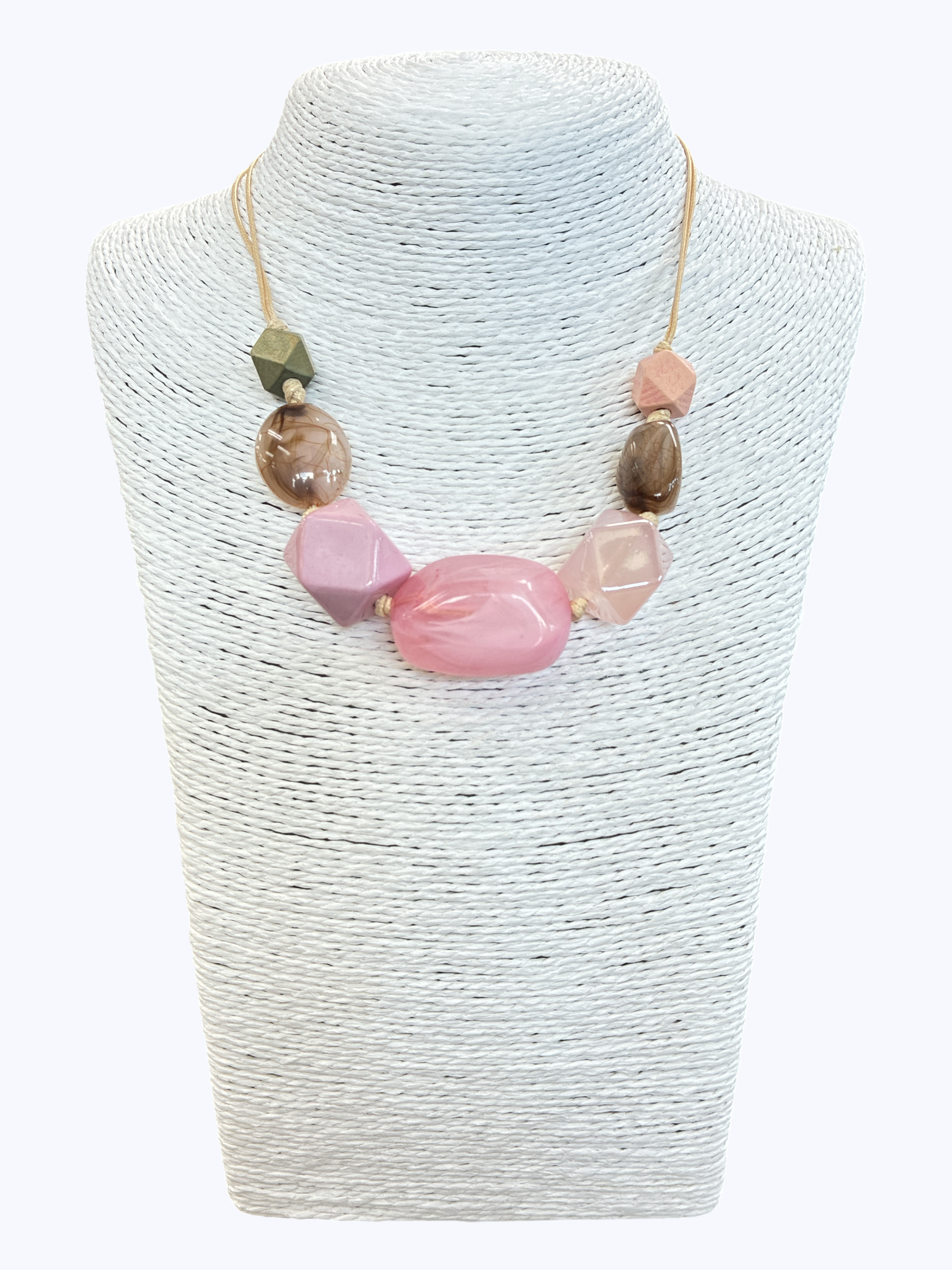 Pink statement bead necklace with glossy marbled resin accents and geometric details on neutral cord for a playful boutique-inspired look.