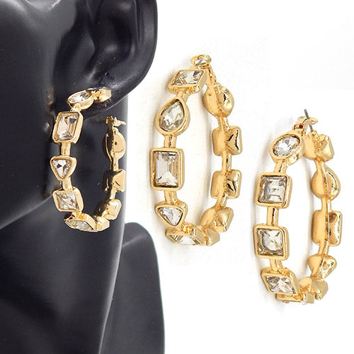 Geometric crystal link hoop earrings with faceted stones in mixed shapes on mannequin display