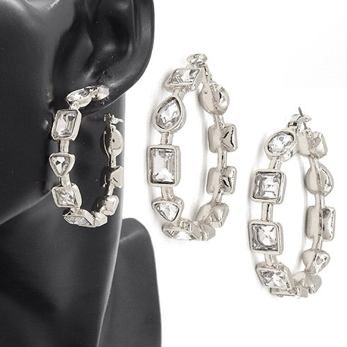 Geometric crystal link hoop earrings with faceted stones in mixed shapes on mannequin display