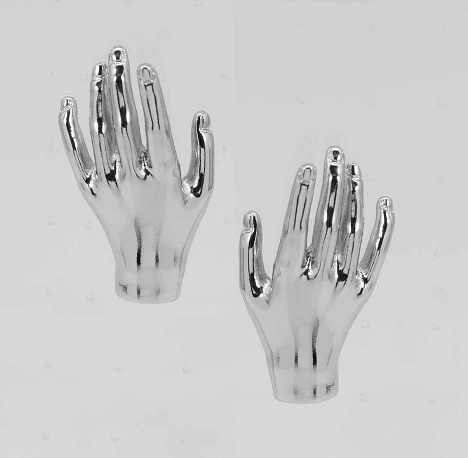 Pair of silver hand-shaped objects on a light gray background