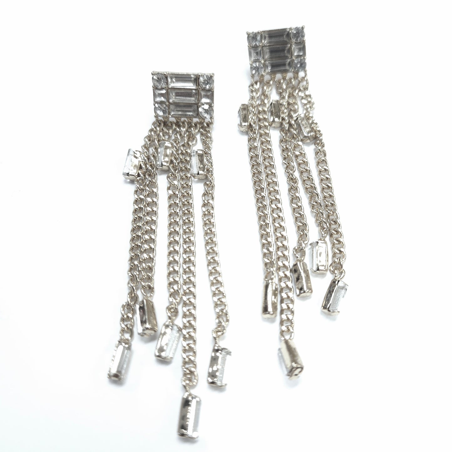 Silver chain earrings with gemstones on a white background