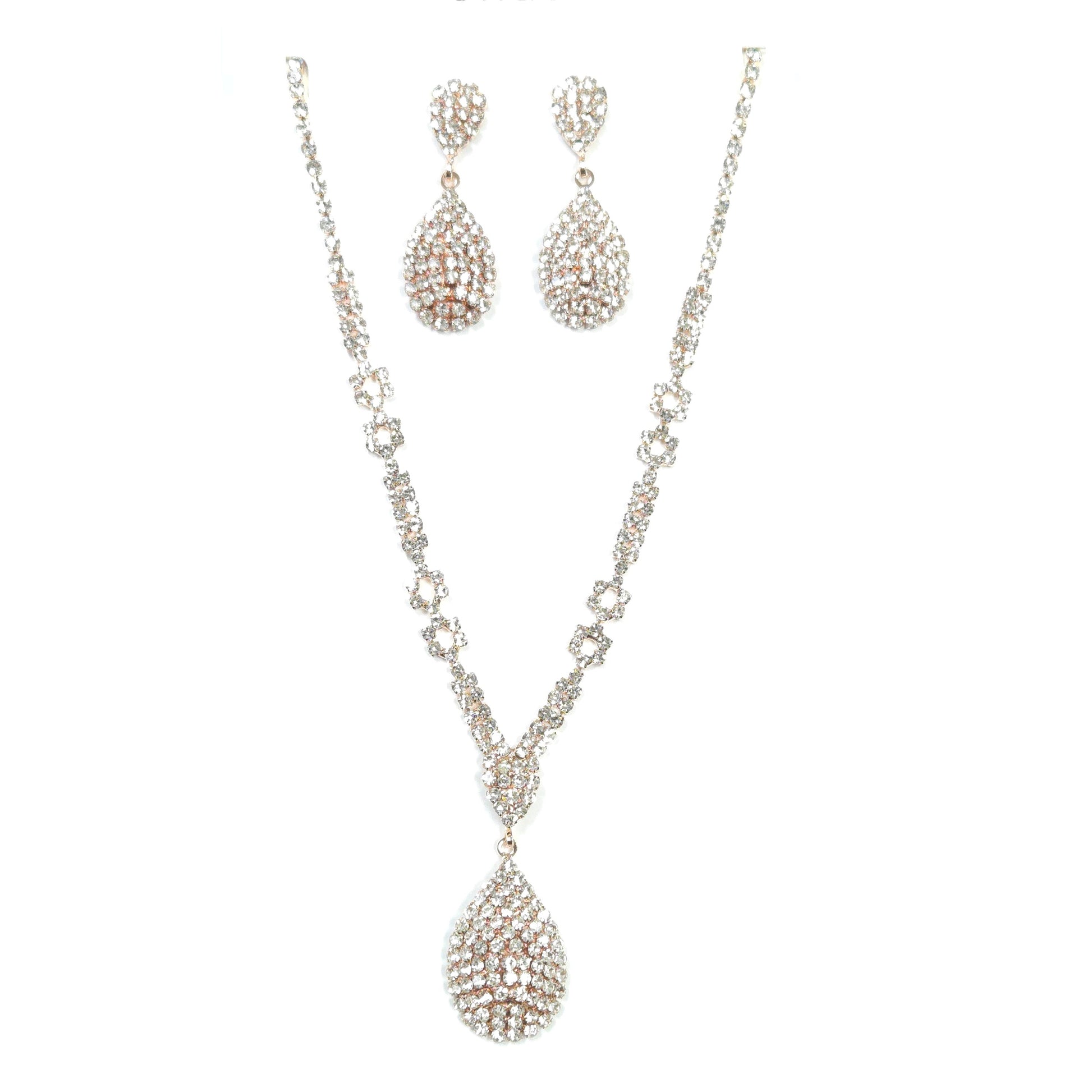 Silver necklace and earrings set on a white background