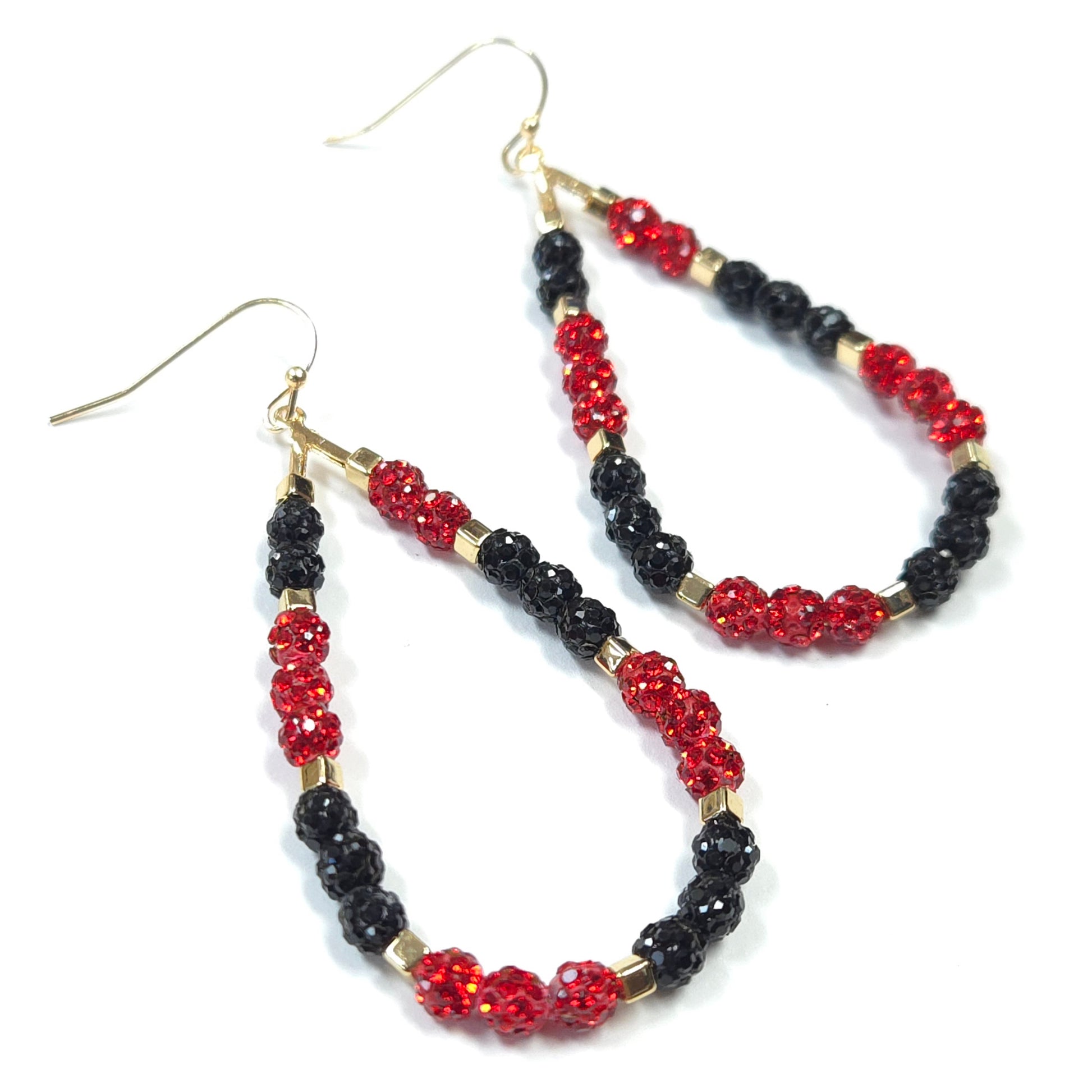 Pair of hoop earrings with red and black beads on a white background