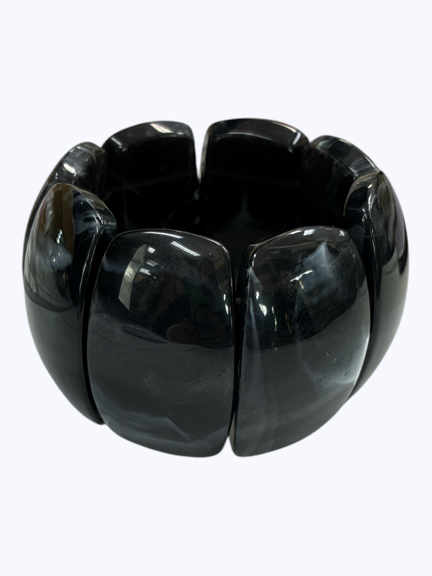 Chunky black marbled stretch bracelet with glossy oversized resin links for a sleek modern boutique statement look.