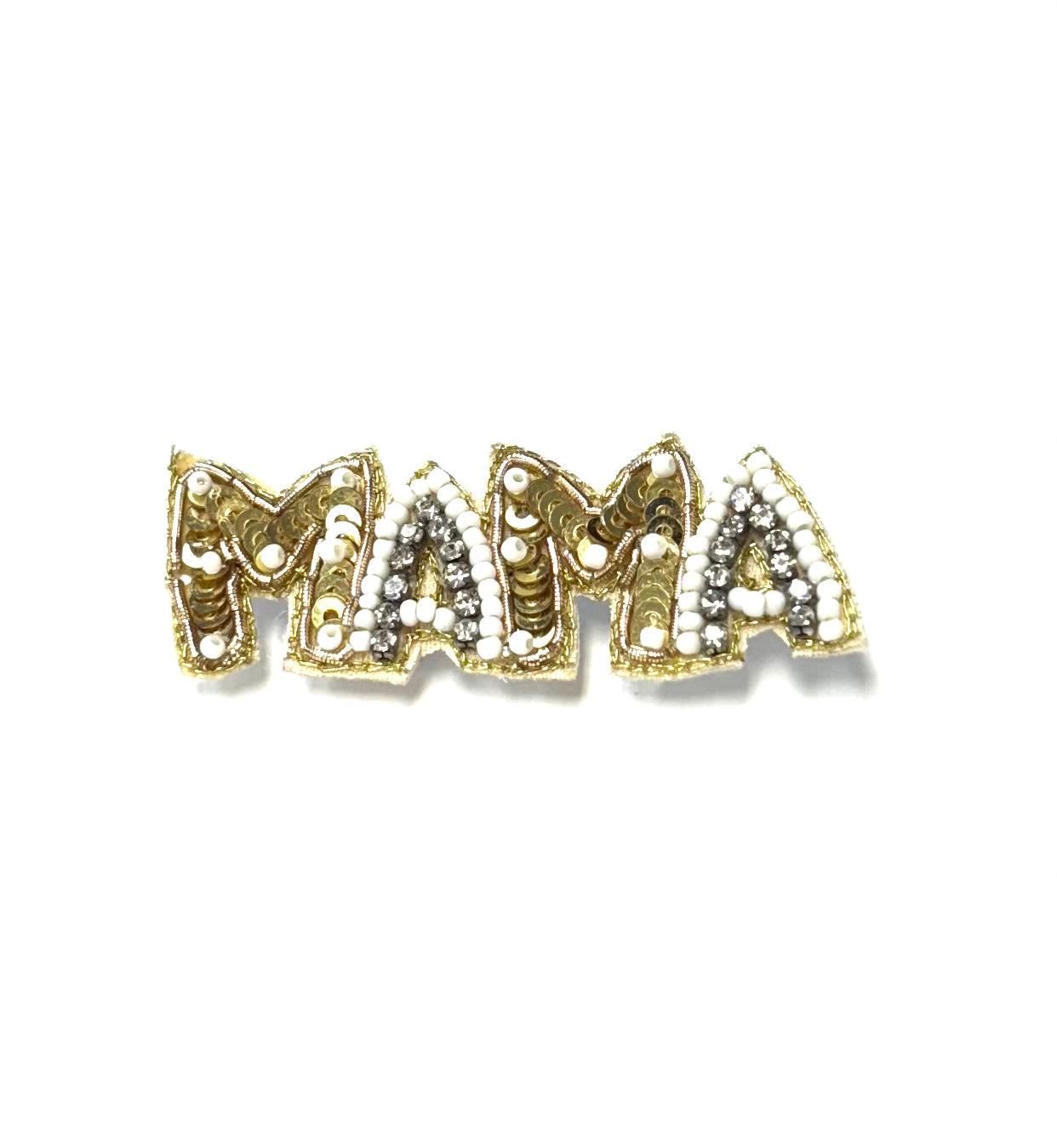 Gold and silver 'MAMA' brooch on a white background