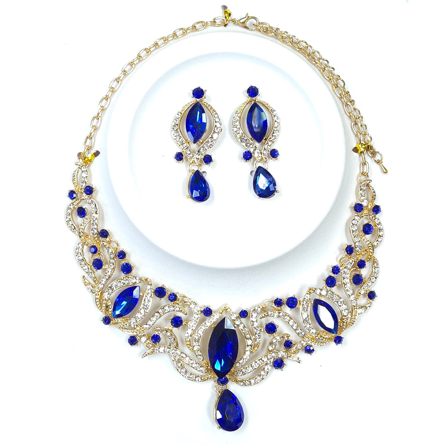 Jewelry set with blue teardrop-shaped stones on a white background