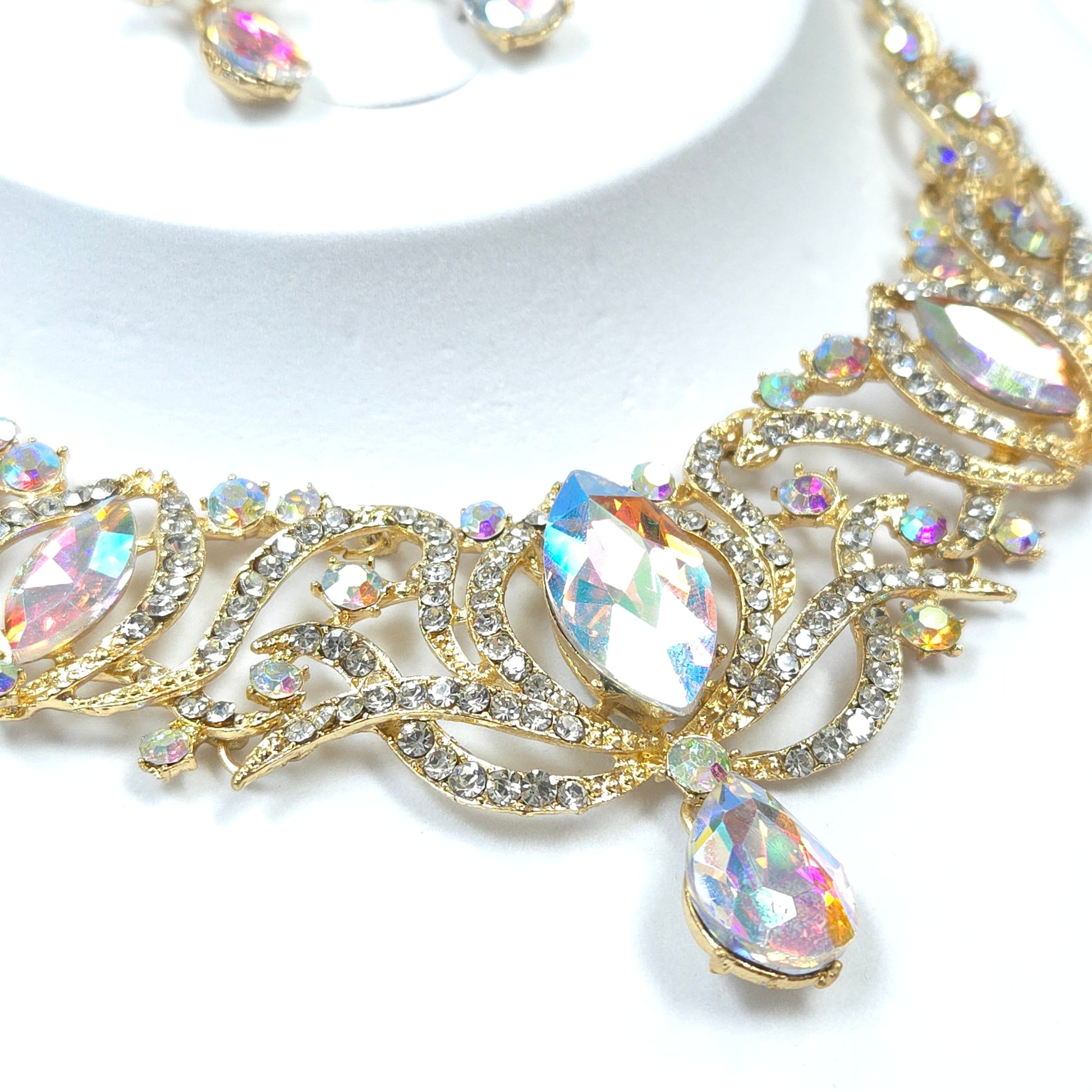 Gold and crystal decorative element on a white background