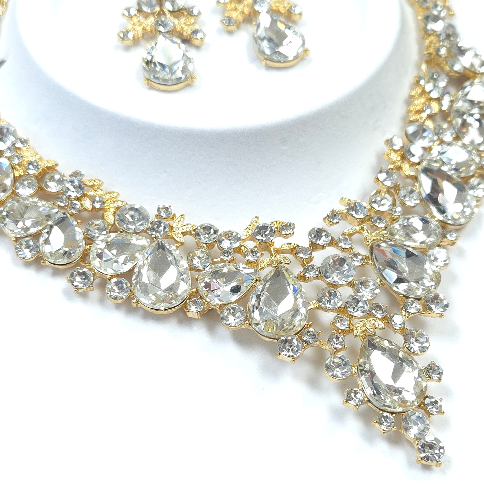 Gold and crystal embellished ribbon on a white background