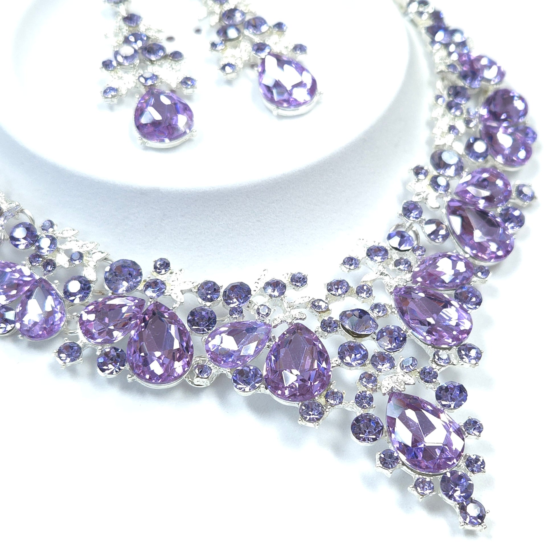 Decorative element with purple gemstones on a white background