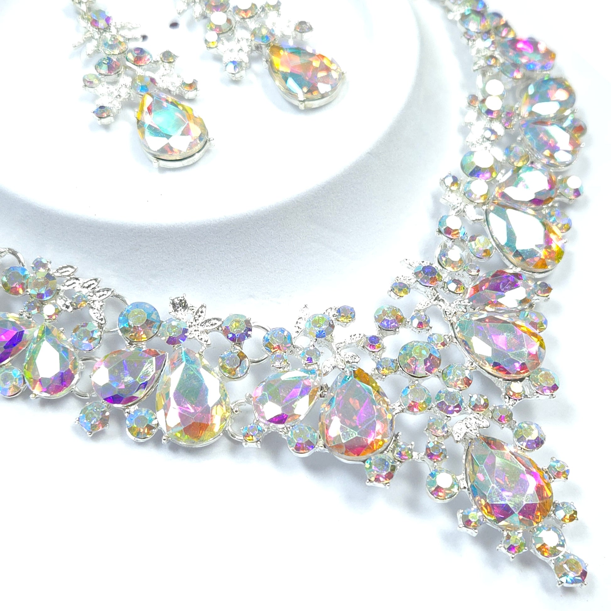 Decorative border with multicolored gemstones on a white background