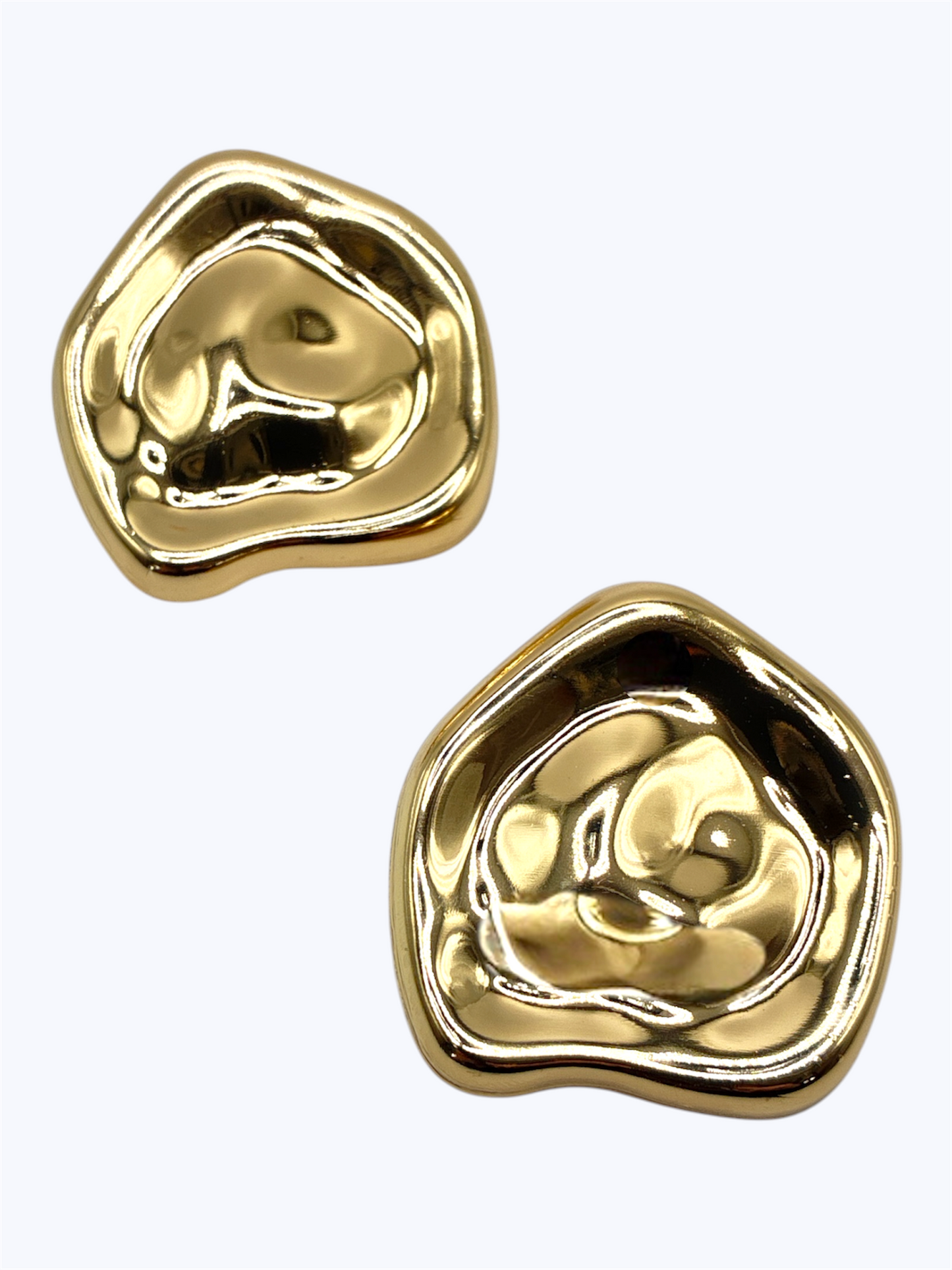 Abstract molten metal stud earrings with organic sculptural shape and polished modern boutique design.