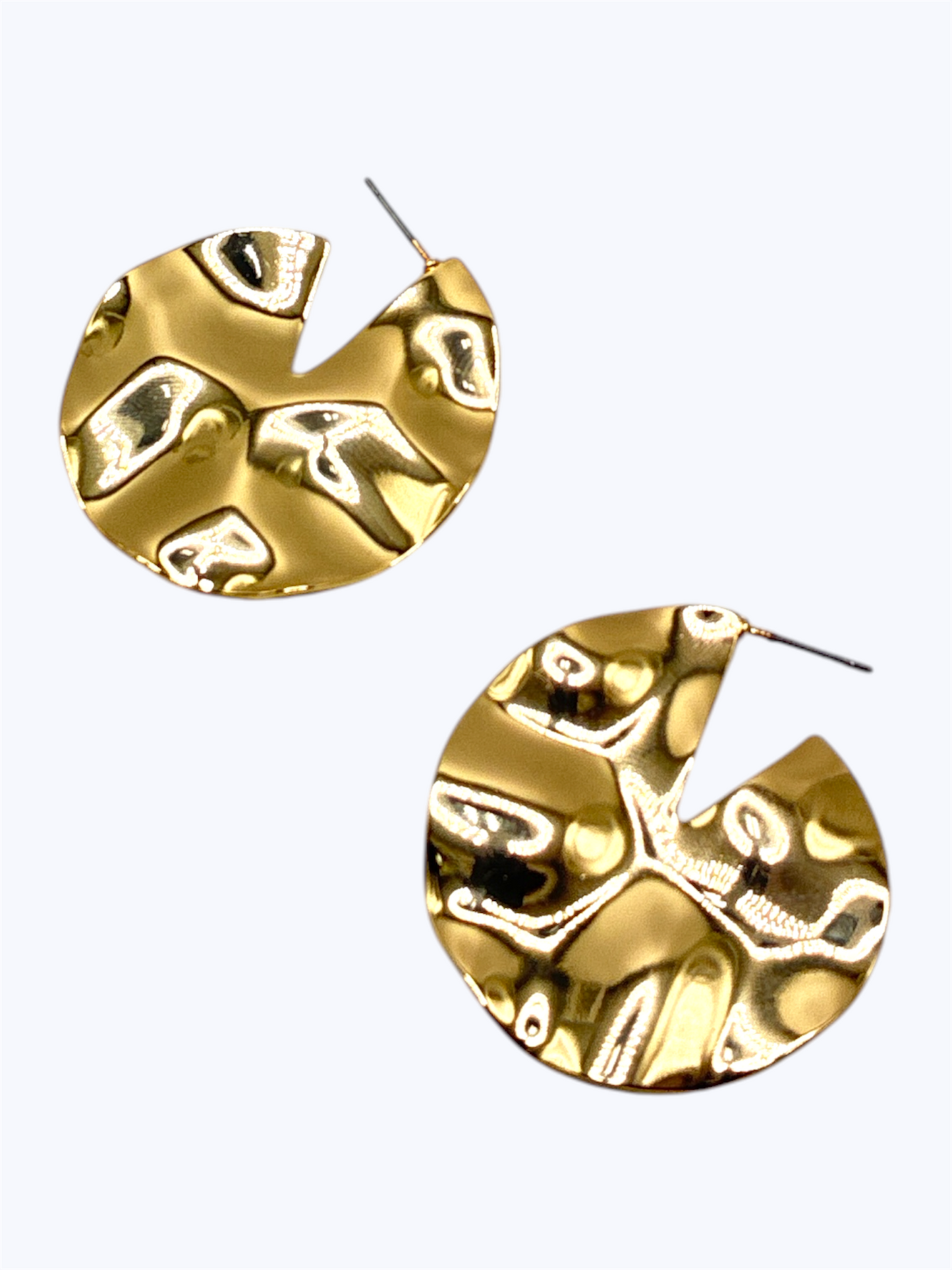 Gold earrings with a textured design on a white background