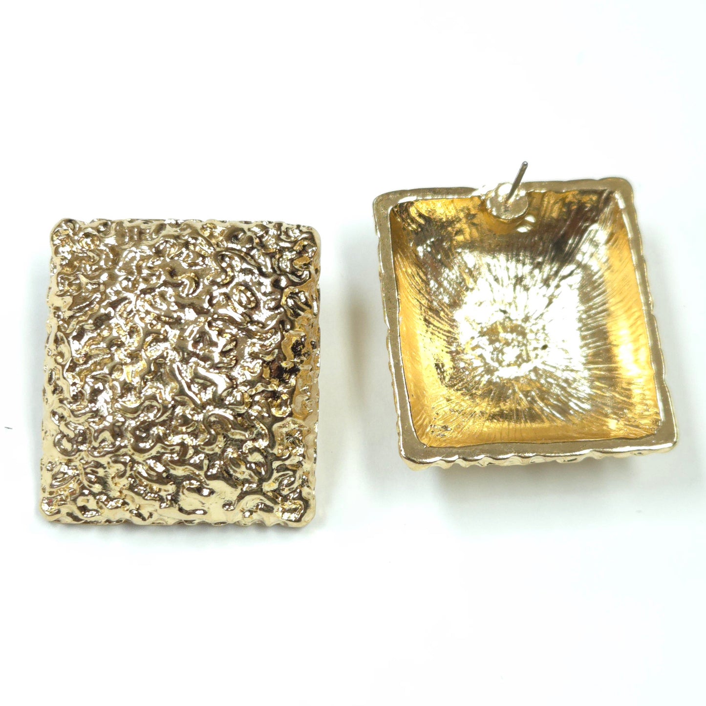Two gold square pendants with textured surfaces on a white background