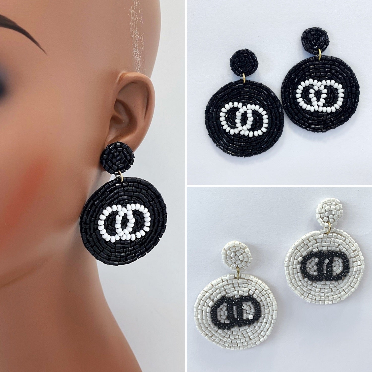 A pair of black and white circle-shaped bead earrings with a dangle post and drop design, displayed on a mannequin head.