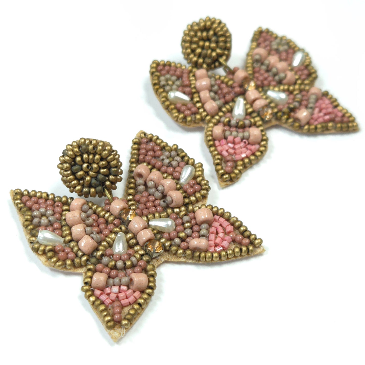 Pair of beaded earrings with pink and gold colors on a white background