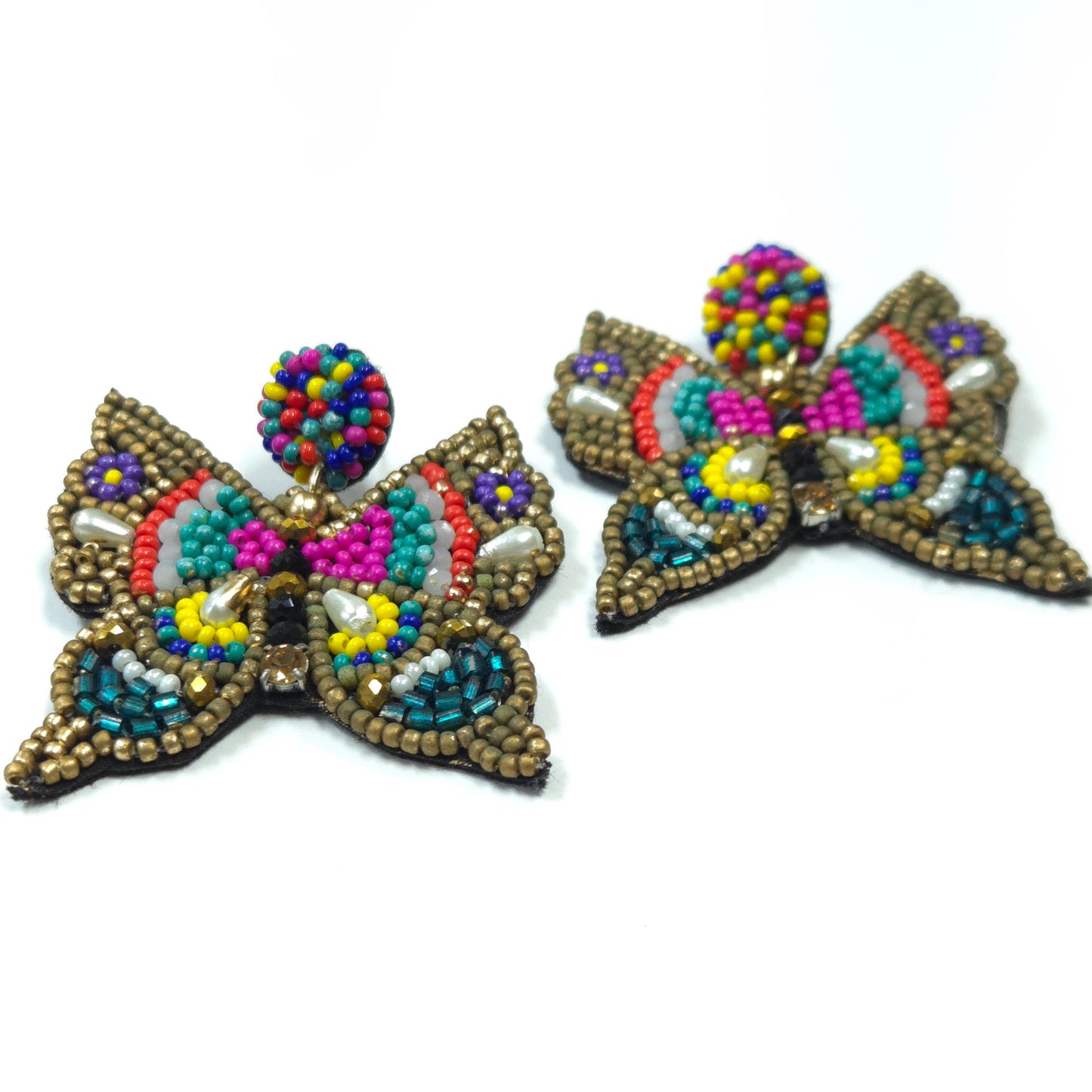 Colorful beaded butterfly earrings on a white background
