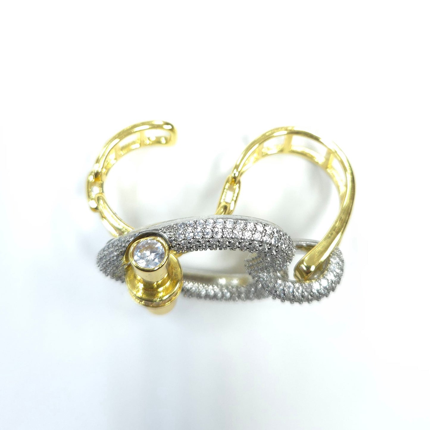 Gold and silver hoop earrings on a white background