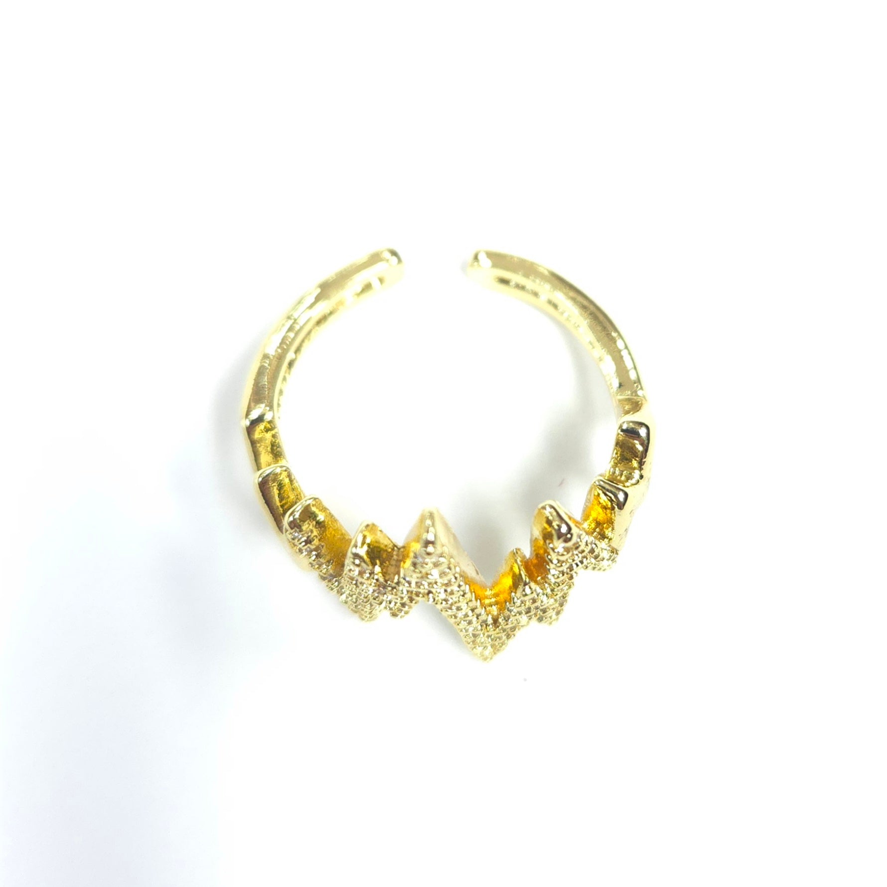 Gold hoop earring on a white background