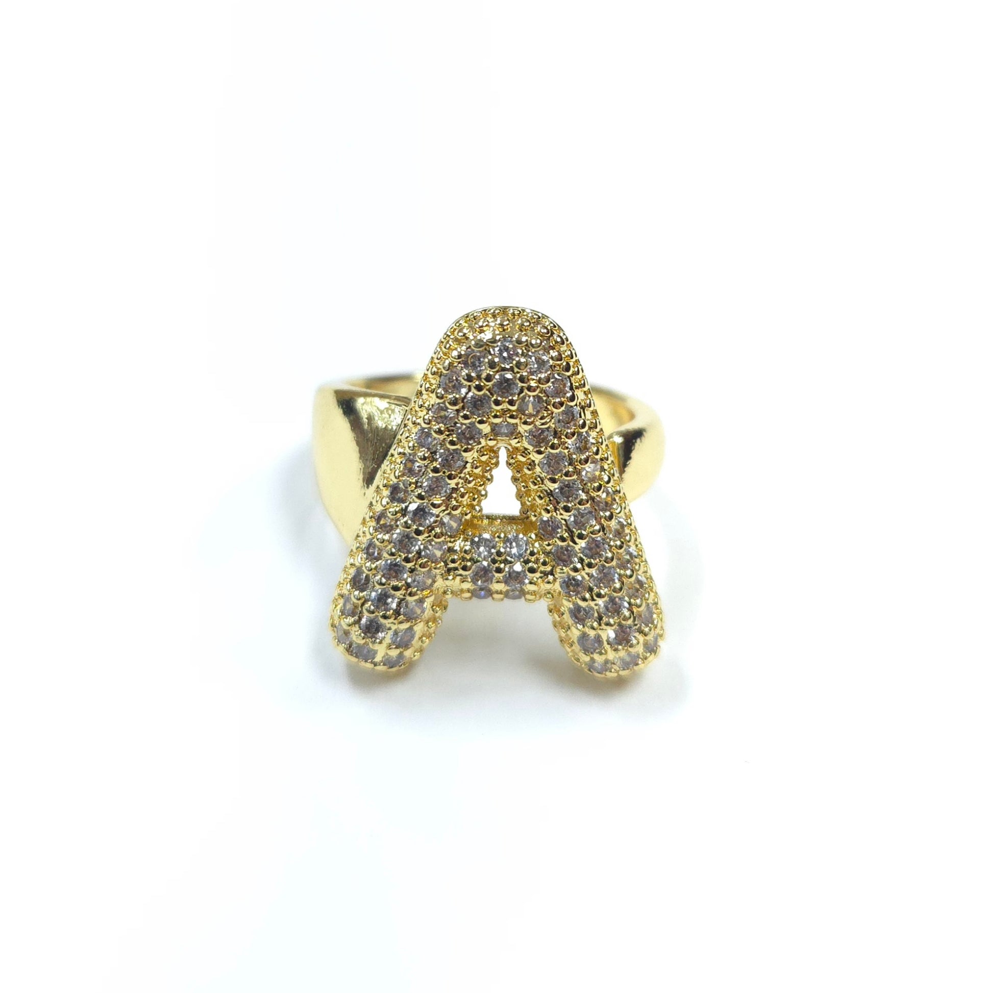 Gold ring with letter 'A' design on a white background