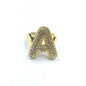 Gold ring with letter 'A' design on a white background