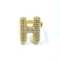 Gold letter 'H' earring with gemstones on a white background