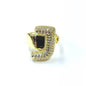 Gold ring with gemstones on a white background