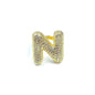 Gold ring with letter 'N' design on a white background