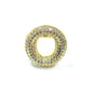 Gold ring with embedded stones on a white background